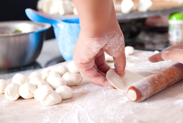 Rolling dough and making dumplings