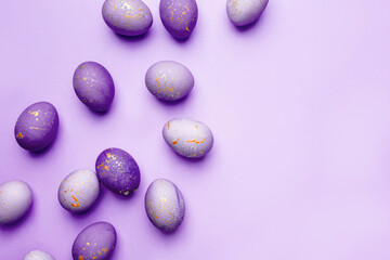 Easter frame of eggs painted in purple color. Flat lay, top view. Copy space for text.