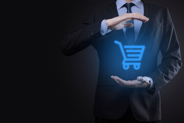 Businessman man holding shopping cart trolley mini cart in business digital payment interface.Business, commerce and shopping concept