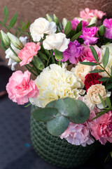 colorful bouquet of spring flowers - spring flower box with cloves, roses and eucalyptus