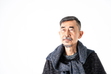 A smile of happy Asian elder man fashion in a gray t-shirt And a sweater on his neck. Shoot On white background in the studio. Positive active old cool senior healthy retirement concept. Copy, space