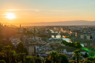 Florence or Firenze sunset aerial cityscape. Panorama view from Michelangelo park square. Ponte Vecchio bridge, Palazzo Vecchio and Duomo Cathedral. Tuscany, Italy