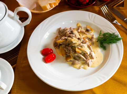Delicious beef stroganoff with gravy, more Swiss