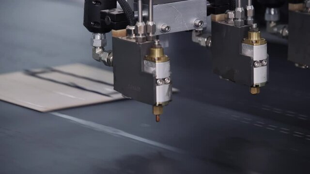 Modern automatic machine line of cardboard box. Offset printing machine - spraying glue. Conveyor line for the production Manufacture of cardboard boxes from paper. gluing of cardboard.