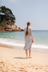 woman walking on the beach spain