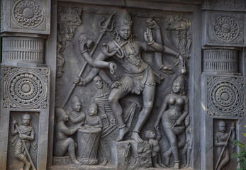 Fototapeta na wymiar Stock photo of intricate sculpture of Indian lord shiva, carved out of stone in ancient hindu temple at Kolhapur city Maharashtra India. focus on object.