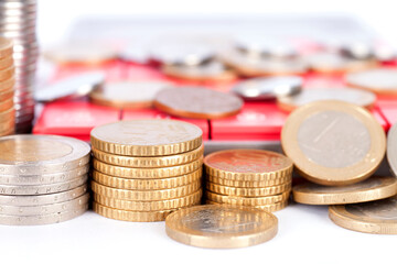 Piles of coins and calculators