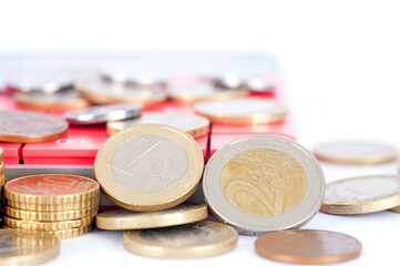 Piles of coins and calculators