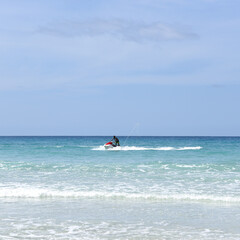 Unrecognizable man on jet ski in the ocean, summer holidays activities.