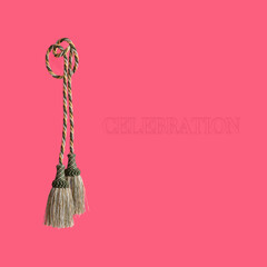 Golden silk tassels isolated on pink background for creating graphic concepts