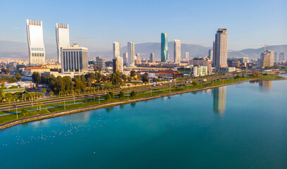 Obraz premium Scenic aerial view of modern cityscape of Izmir along shoreline of Aegean Sea on sunny winter day, Turkey