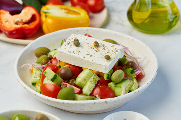 Greek village salad horiatiki with feta cheese and vegetables, vegeterian mediterranean food, low calories keto dieting meal, side view, close up