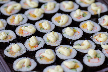 Sushi Set nigiri and sushi rolls with tea served