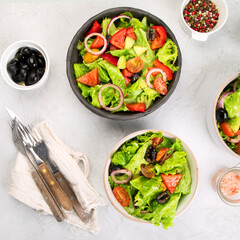 Fresh vegetables salad on light gray background. Healthy eating concept.