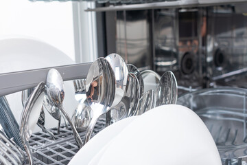 Full load dishwashing machine. Clean dishes and cutlery