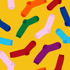 Multi-colored socks on a yellow background seamless pattern