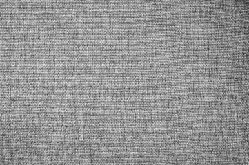 Fototapeta na wymiar Fabric knitted textured gray background