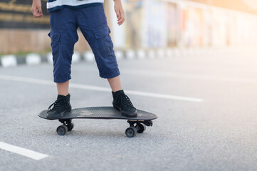 Close Up leg on surf skate or skateboard on a skate park extreme sports. Concept family activity lifestyle of the new generation for good health and exercise
