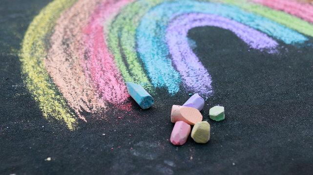 Drawn Rainbow With Sidewalk Chalk On The Ground.