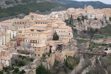 Fototapeta na wymiar View of Hanged Houses (Casas Colgadas) and San Pablo bridge in Cuenca (Spain) taking from a hill.