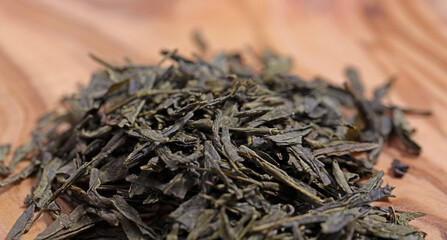 Green tea dried and rolled leaves