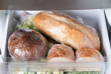 Frozen bread in the home freezer. Frozen bread: ciabatta, hamburger buns, loaf