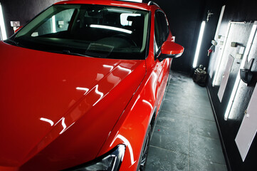 Fototapeta premium Nice and new orange sport suv car in modern garage.