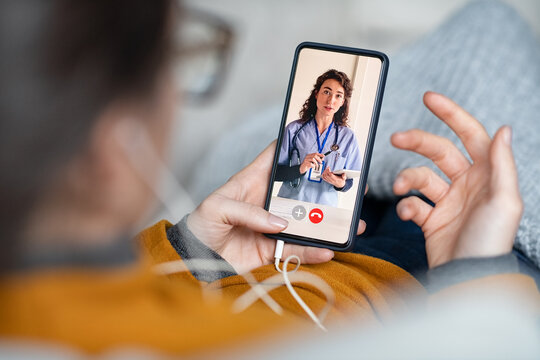 Woman doing video call with doctor