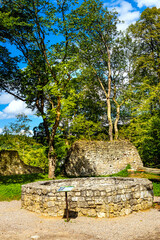 Ruins of medieval royal Ojcow Castle with inner courtyard and well on Cracow-Czestochowa upland in Lesser Poland