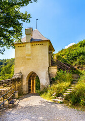 Gate tower and limestone rocky defense walls of medieval royal Ojcow Castle on Cracow-Czestochowa upland in Lesser Poland