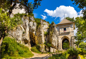 Gate tower and limestone rocky defense walls of medieval royal Ojcow Castle on Cracow-Czestochowa upland in Lesser Poland