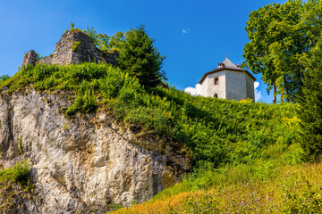 Limestone rocky defense walls and towers of medieval royal Ojcow Castle on Cracow-Czestochowa upland in Lesser Poland