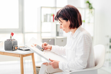 Woman drawing with watercolor