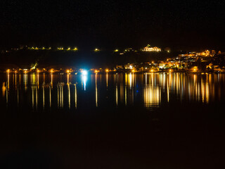 Night view of Zell am Zee on a lake in Austria.