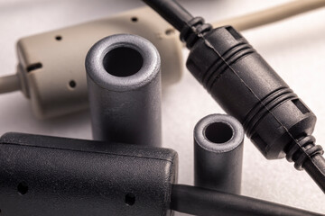 Close up of a ferrite bead inductor. An electrical element that suppresses high-frequency...