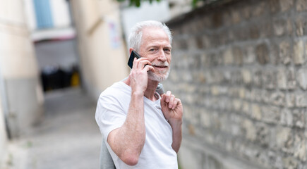 Mature man using his mobile phone