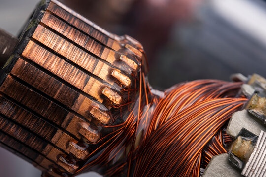 Copper commutator bar of the electric motor close up. Electric motor rotor.