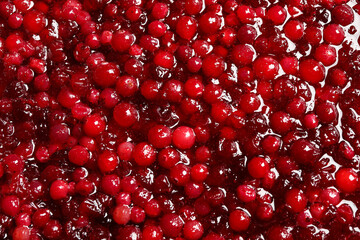 Fresh juicy cranberry sauce as background, closeup