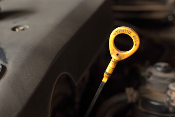 Automotive engine oil level gauge lever