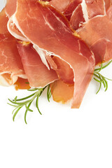 Prosciutto crudo isolated on white background. Italian or Spanish traditional dried meat.
