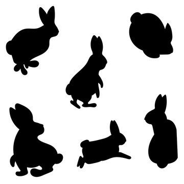 Rabbits  icon set black. Silhouettes of rabbits in different poses. Vector isolated images on white background. Template for kids craft, wooden carwing, decor, stamps.