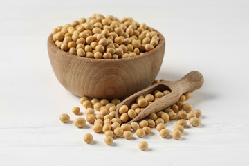 Bowl and scoop with soy on white table