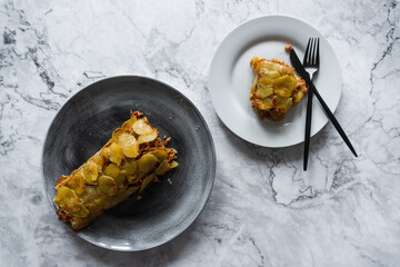 baked potato roll with minced chicken on a plate