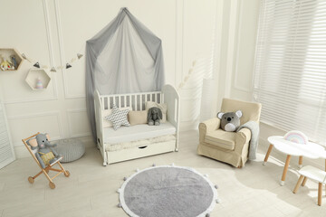 Fototapeta na wymiar Cozy baby room interior with crib and toys