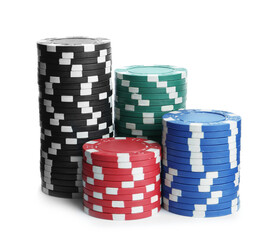 Plastic casino chips stacked on white background. Poker game