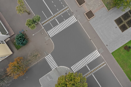 Aerial view of white pedestrian crossings on city street
