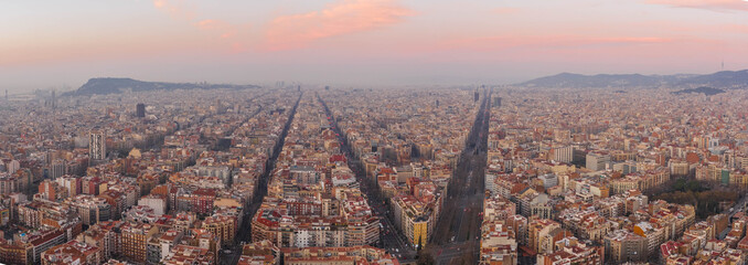 Aerial panorama drone shot of Barcelona city center empty street before sunrise at Spain winter morning