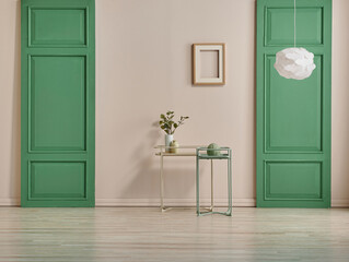 Green room wall and lamp concept, gold vase of plant, round object and chair style.