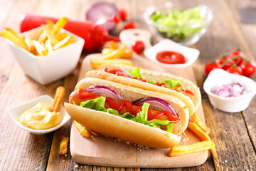 hot dog- sandwich with sausage and lettuce with sauce