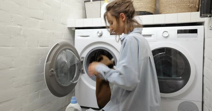 Woman washing clothes at home